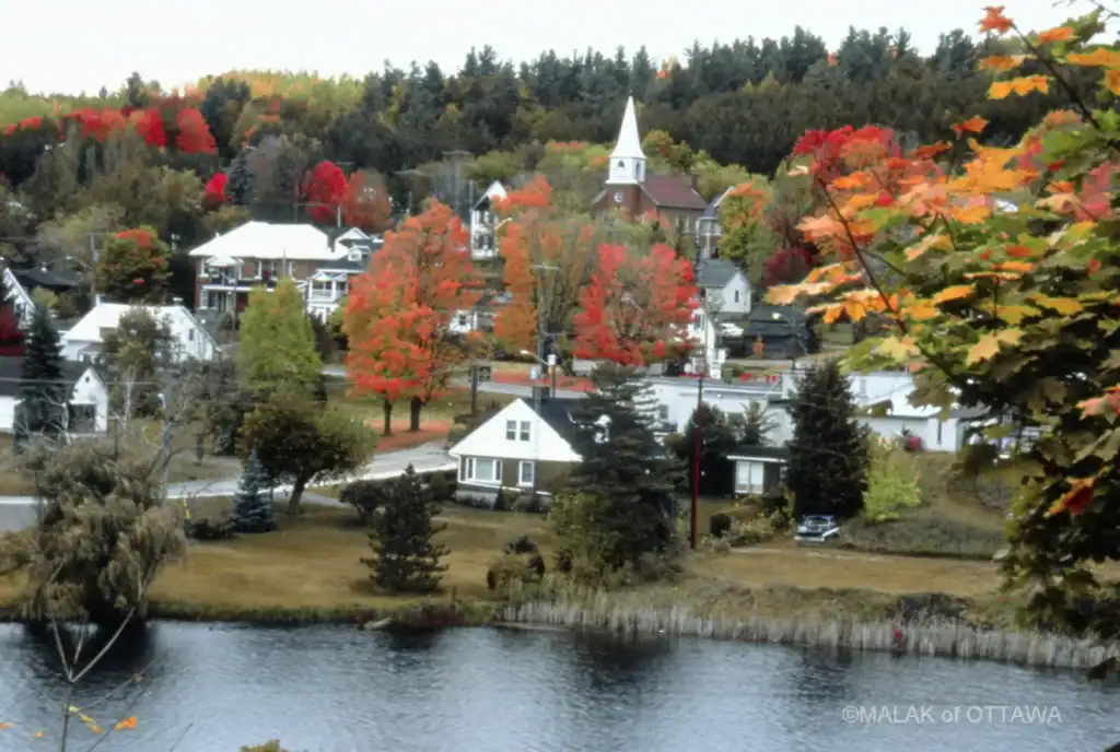 Autumn landscape in Ottawa with colorful fall foliage and a serene river view.