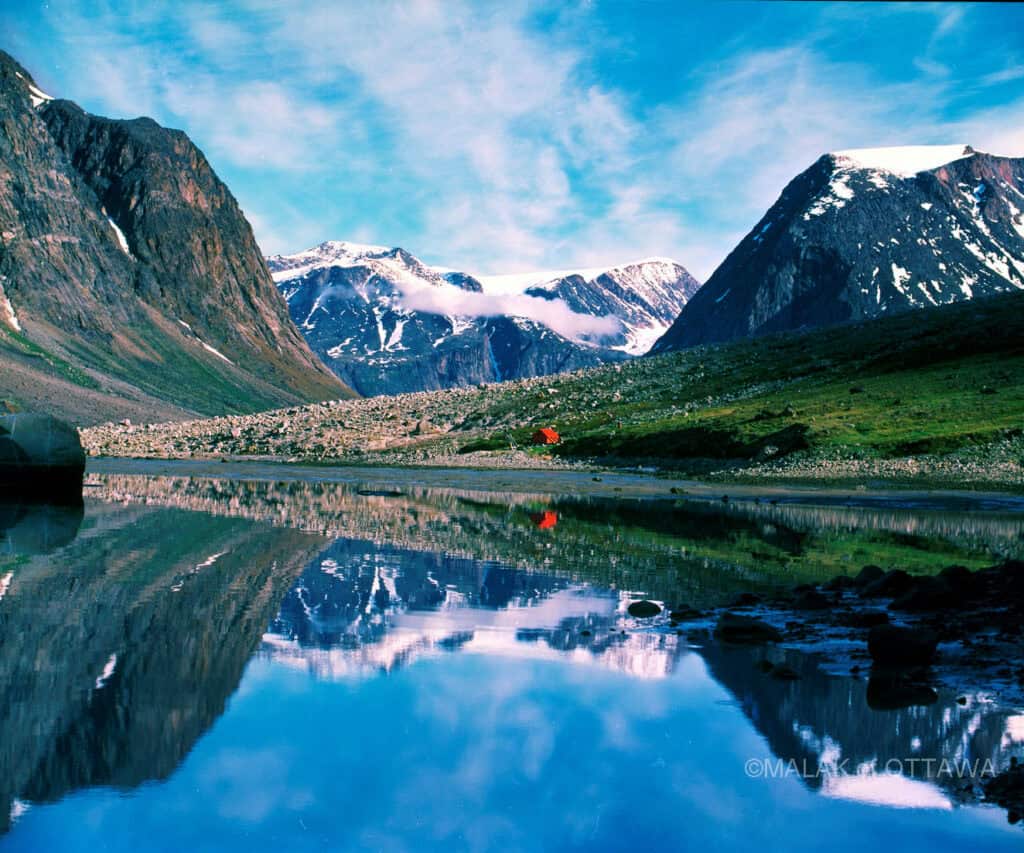 Auyuittuq National Park with towering mountains and a reflective fjord in Ottawa.