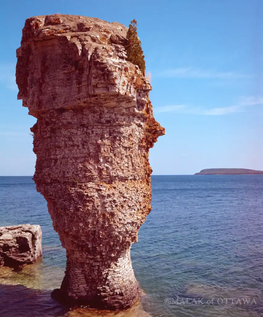 Rock formation resembling a face by the water in Ottawa.
