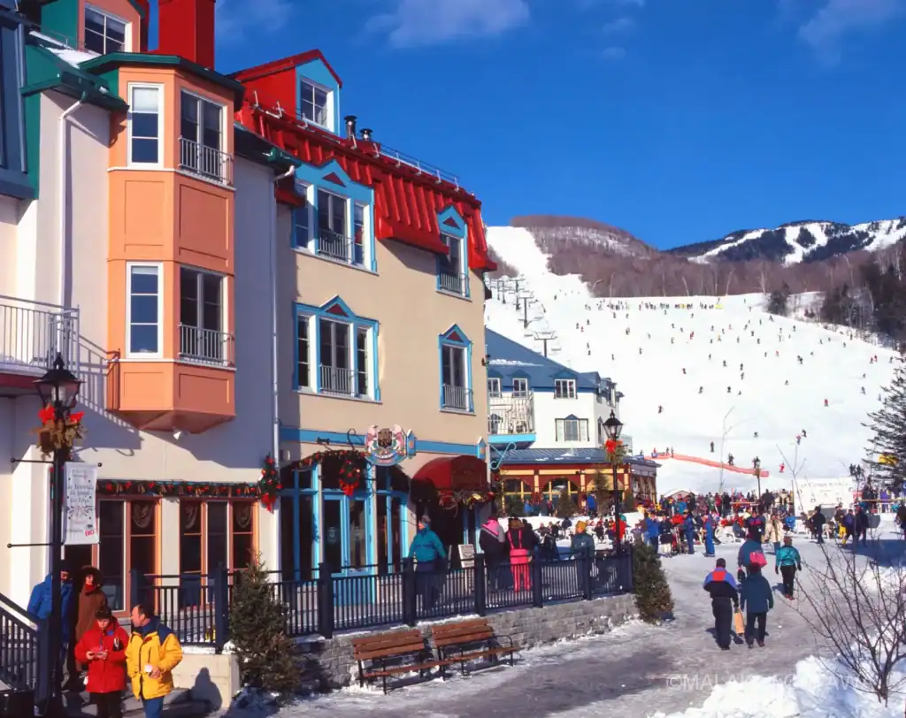 Ski resort in Ottawa with colorful buildings and snowy slopes.